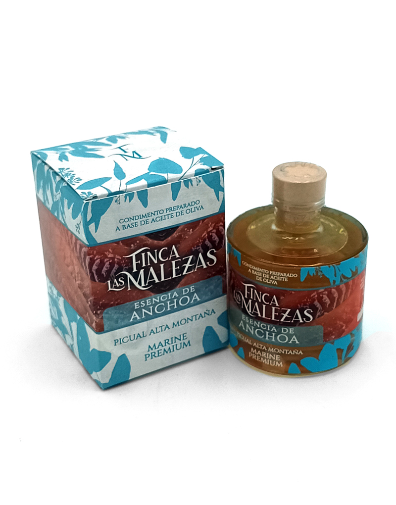 1776794962470 - El Gourmext de Casa Chino Box and round bottle of Finca Las Malezas Esencia de Anchoa, Marine Premium olive‑oil condiment with blue and brown packaging.