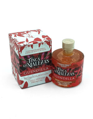 Bottle and box of Finca Las Malezas Guindilla chili peppers premium olive oil condiment, red labeled with a beige cap.