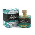 Bottle of Finca Las Malezas Trufa Negra black truffle oil beside its teal and black box.**/placeholder