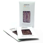 White Fermín packaging for Iberico salchichón with a clear window showing sliced cured meat.