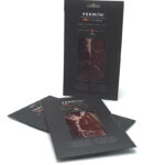 1777484622524 - El Gourmext de Casa Chino Dark packaging for Fermín 100% Ibérico ham with a transparent window showing sliced meat; several packages standing and one upright, product branding visible.