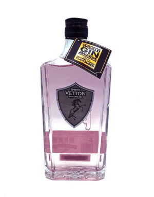 Pink gin bottle with a black cap and a gold award tag hanging from the neck; label shows Vetton Distilling Co.