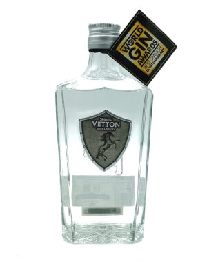 Clear gin bottle with a Vetton Distilling Co shield logo on the front and a World Gin Awards tag attached to the neck