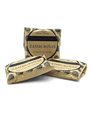Three brown paper-wrapped packages of Zamburiñas en salsa de vieira, labeled Edición Limitada (Limited Edition).
