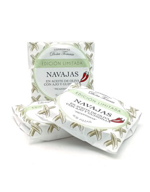 Two wrapped tins of Navarra razor clams in olive oil with garlic and chili, labeled 'Edición Limitada' (limited edition).
