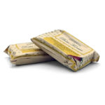 Two wrapped cans of sardines in beige parchment-style packaging, stacked on a white background.