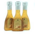 1777484625361 - El Gourmext de Casa Chino Three bottles of white truffle sauce with beige labels and silver caps.