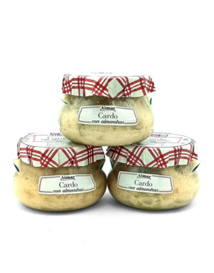 Three glass jars of Cardo con almendras arranged in a triangle, with red plaid cloth lids and white labels.