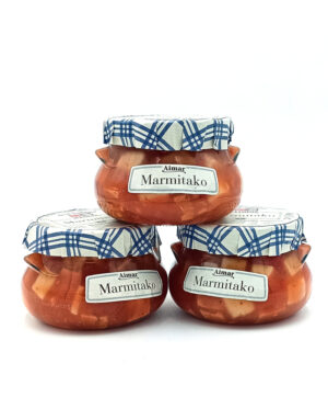Three glass Marmitako jars with blue plaid lids stacked against a white background, displaying the product.