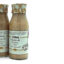 Three bottles of Aimar Crema de Boletus edulis cream on a white background, with patterned foil tops tied around the caps.