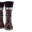 Two clear pepper mills filled with mixed peppercorns standing side by side on a white background.