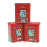 Three red paprika tins stacked together, labeled Pimentón 'El Ángel' Dulce (Sweet Paprika) on white background.
