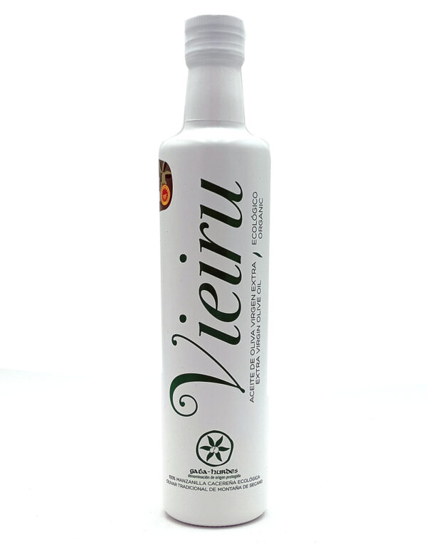 Tall white bottle of extra virgin olive oil with green cursive branding and a white cap, Eco/organic labeling visible on the side.