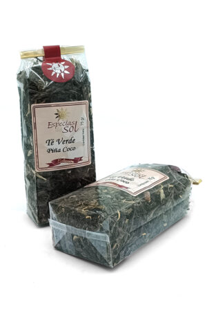 1776794963571 - El Gourmext de Casa Chino Two packaged tea bags of Especias del Sol Te Verde Piña Coco, green tea with pineapple coconut scent, in clear plastic wrapping on a white background (front and side views).