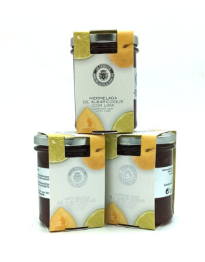 Three boxes of apricot jam with lime arranged around a glass jar on a white background.