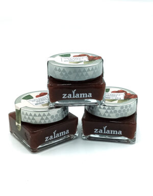 1778794818639 - El Gourmext de Casa Chino Three ZaLama glass jars with gray patterned lids containing chocolate spread, stacked on a white background.