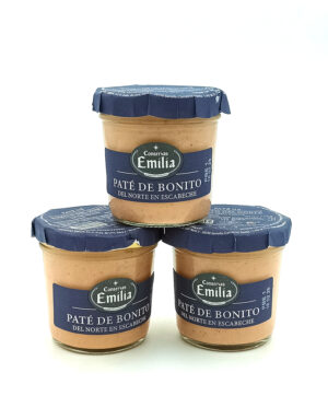 1778794819727 - El Gourmext de Casa Chino Three glass jars of Paté de Bonito tuna pâté from Conservas Emilia with blue foil lids, arranged in a small pyramid on a white background.