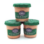 1778794819744 - El Gourmext de Casa Chino Three jars of Emilia Conservas Paté de Bonito del Norte en aceite stacked in a pyramid on a white background