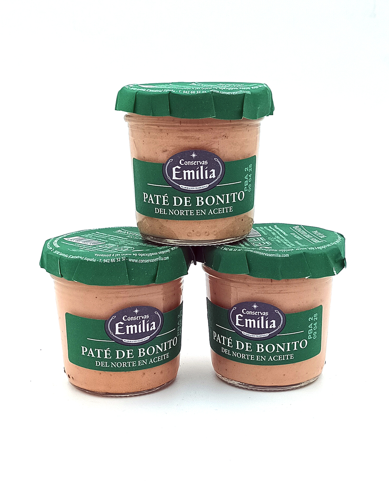 1778794819744 - El Gourmext de Casa Chino Three jars of Emilia Conservas Paté de Bonito del Norte en aceite stacked in a pyramid on a white background