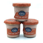 1778794819840 - El Gourmext de Casa Chino Three jars of Emilia Paté de Anchoa anchovy paste stacked on a white background, with orange lids and labels.