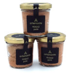 1778794819847 - El Gourmext de Casa Chino Three glass jars of perdiz pâté stacked in a pyramid, with black labels and gold lids labelled artemonte.