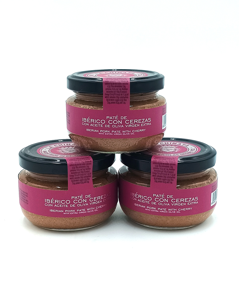 1778794819929 - El Gourmext de Casa Chino Three jars of Iberico pork pâté with cherry in extra virgin olive oil, pink label and black lids on a white surface.