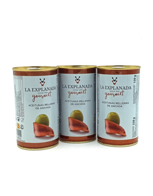 1778794820162 - El Gourmext de Casa Chino Three La Explanada Gourmet stuffed anchovy olives cans arranged in a row on a white background.