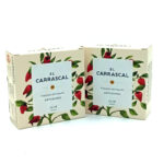 1778794820307 - El Gourmext de Casa Chino Two cream boxes with red chili pepper illustrations and a white label that reads 'El CARRASCAL'—artisanal piquillo peppers (Artesanos).