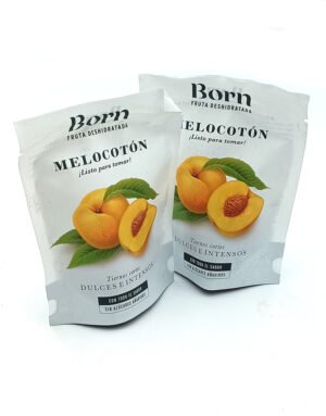 1778794820781 - El Gourmext de Casa Chino Two white foil pouches labeled Born Fruta Deshidratada, featuring peaches with green leaves and the words Melocotón, ¡Listo para tomar!, sin azúcares añadidos.