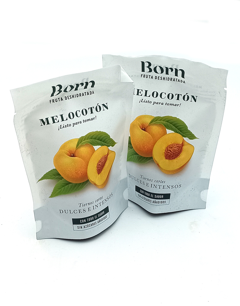 1778794820781 - El Gourmext de Casa Chino Two white foil pouches labeled Born Fruta Deshidratada, featuring peaches with green leaves and the words Melocotón, ¡Listo para tomar!, sin azúcares añadidos.