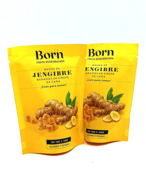 1778794820826 - El Gourmext de Casa Chino Two yellow stand-up pouches labeled Born Fruta Deshidratada with 'Jengibre' ginger candy, showing ginger pieces on the front.